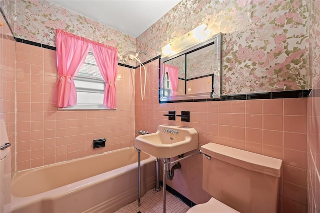 150-44 23rd Ave, Whitestone, NY 11357 - full bathroom with wallpapered walls, tile walls, toilet, shower / bathtub combination, and wainscoting