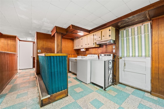 150-44 23rd Ave, Whitestone, NY 11357 - laundry room featuring washer and clothes dryer, wood walls, light flooring, cabinet space, and baseboards