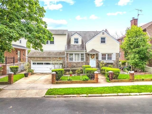 150-44 23rd Ave, Whitestone, NY 11357 - view of front of home featuring concrete driveway, a fenced front yard, an attached garage, and stone siding