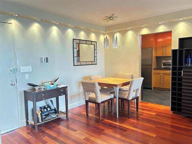 ONE Bay Club Dr Unit 18S, Bayside, NY 11360 - dining room featuring dark wood-style flooring and baseboards