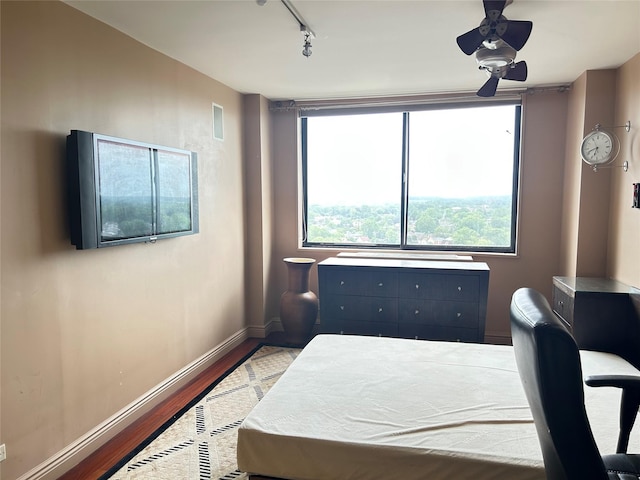 ONE Bay Club Dr Unit 18S, Bayside, NY 11360 - bedroom featuring wood finished floors, baseboards, and rail lighting