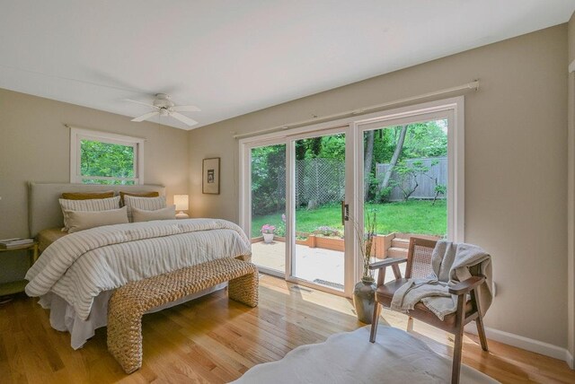 10 Maple Ave, Setauket, NY 11733 - bedroom with access to exterior, multiple windows, wood finished floors, and baseboards