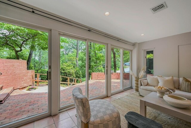 10 Maple Ave, Setauket, NY 11733 - sunroom featuring tile patterned floors and recessed lighting