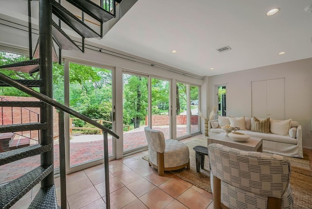 10 Maple Ave, Setauket, NY 11733 - living area featuring light tile patterned flooring, recessed lighting, and stairs
