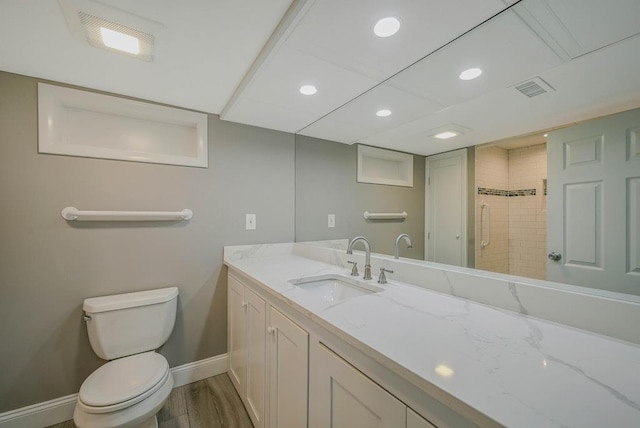 10 Maple Ave, Setauket, NY 11733 - bathroom featuring baseboards, vanity, toilet, recessed lighting, and wood finished floors