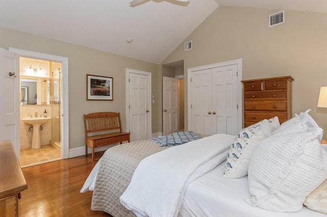 12 5th Pl, Garden City, NY 11530 - bedroom with wood finished floors, high vaulted ceiling, a sink, a closet, and baseboards
