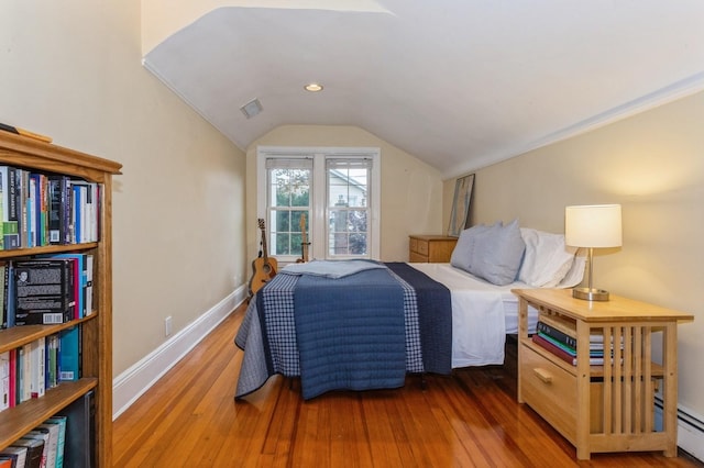 12 5th Pl, Garden City, NY 11530 - bedroom featuring vaulted ceiling, hardwood / wood-style flooring, baseboard heating, and baseboards
