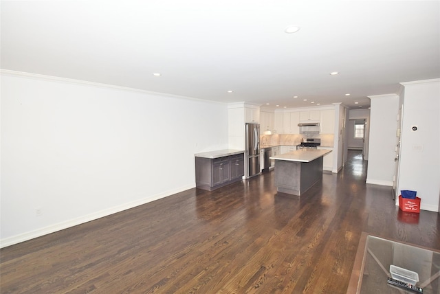 206-07 Lori Dr Unit 60M, Bayside, NY 11360 - unfurnished living room with ornamental molding, recessed lighting, dark wood finished floors, and baseboards