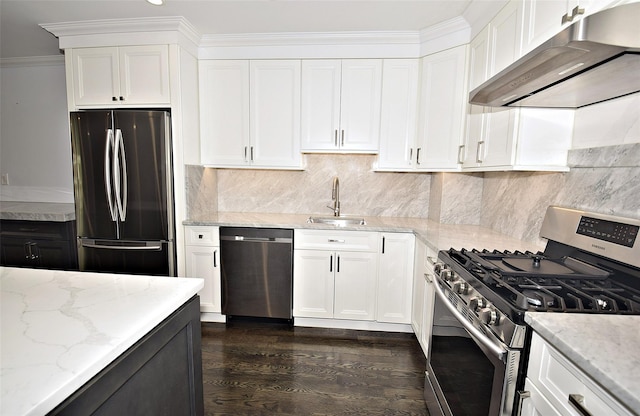 206-07 Lori Dr Unit 60M, Bayside, NY 11360 - kitchen with stainless steel appliances, wall chimney range hood, a sink, light stone counters, and white cabinetry