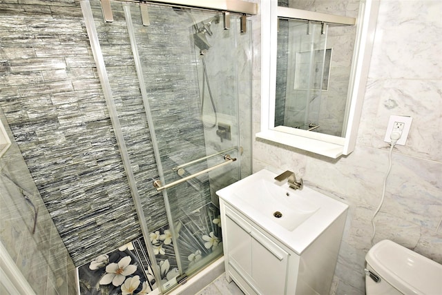 206-07 Lori Dr Unit 60M, Bayside, NY 11360 - full bath with vanity, a shower stall, toilet, and tile walls