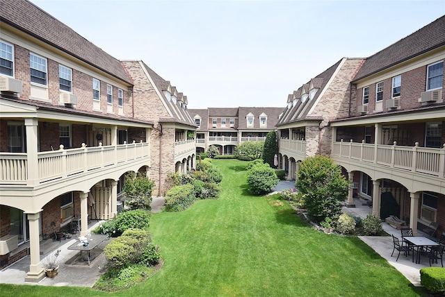 206-07 Lori Dr Unit 60M, Bayside, NY 11360 - view of grassy yard with a patio and cooling unit