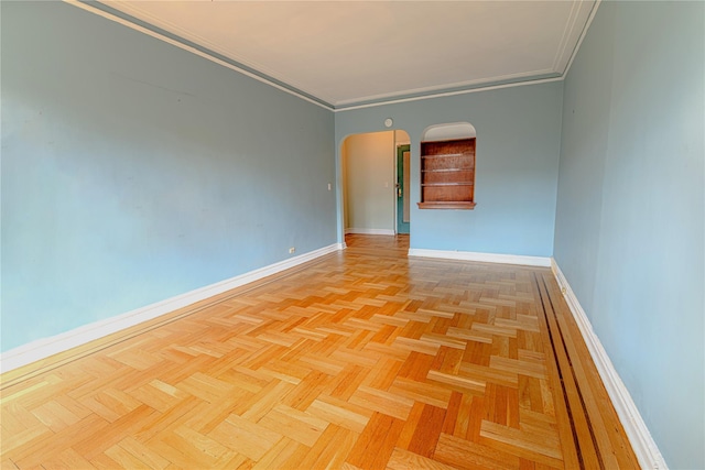 190 E Mosholu Pkwy S Unit 3H, Bronx, NY 10458 - empty room with baseboards, arched walkways, and crown molding
