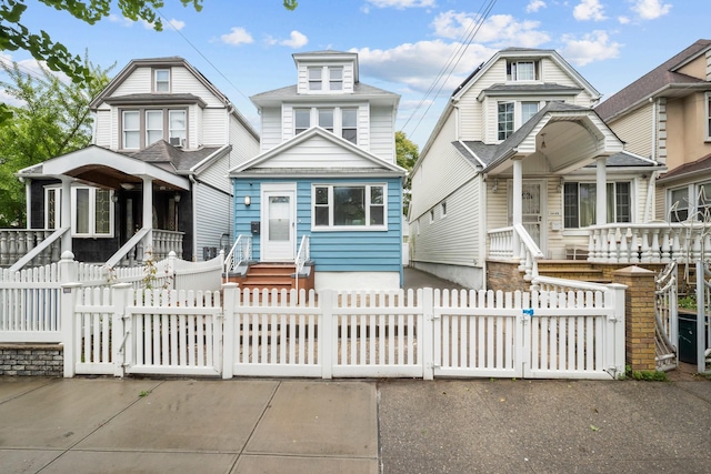 114-23 Sutter Ave, South Ozone Park, NY 11420 - view of front of property with a gate, a porch, and a fenced front yard