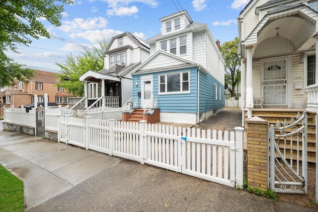 114-23 Sutter Ave, South Ozone Park, NY 11420 - view of front of house with a gate and a fenced front yard