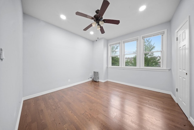 114-23 Sutter Ave, South Ozone Park, NY 11420 - unfurnished bedroom with baseboards, recessed lighting, wood finished floors, and ceiling fan