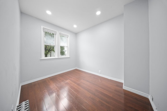 114-23 Sutter Ave, South Ozone Park, NY 11420 - unfurnished room with wood finished floors, baseboards, and recessed lighting