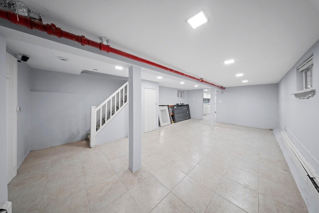 114-23 Sutter Ave, South Ozone Park, NY 11420 - finished basement with stairs, recessed lighting, light tile patterned floors, and baseboard heating
