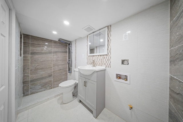 114-23 Sutter Ave, South Ozone Park, NY 11420 - bathroom featuring tile walls, vanity, tiled shower, toilet, and recessed lighting