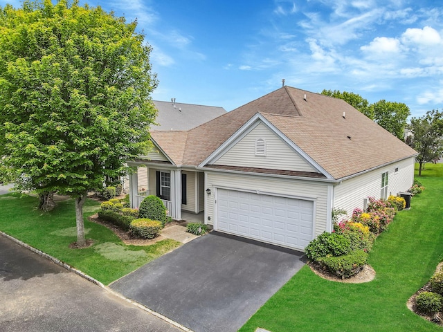 105 Louden Loop, Mount Sinai, NY 11766 - traditional-style house featuring driveway, an attached garage, a front lawn, and a shingled roof