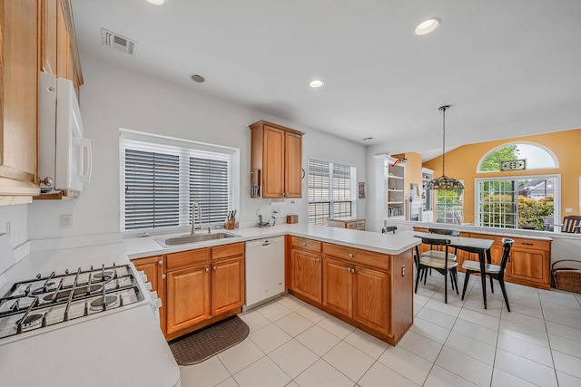 105 Louden Loop, Mount Sinai, NY 11766 - kitchen with white appliances, a sink, a peninsula, light countertops, and recessed lighting