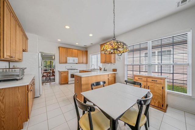105 Louden Loop, Mount Sinai, NY 11766 - kitchen with white appliances, a sink, light tile patterned flooring, light countertops, and recessed lighting