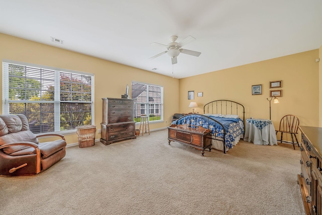 105 Louden Loop, Mount Sinai, NY 11766 - carpeted bedroom featuring multiple windows, a ceiling fan, and baseboards