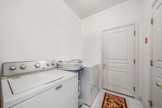 105 Louden Loop, Mount Sinai, NY 11766 - washroom featuring washer and clothes dryer and light tile patterned floors