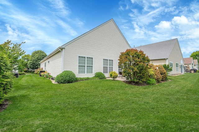 105 Louden Loop, Mount Sinai, NY 11766 - view of property exterior featuring a yard and a patio