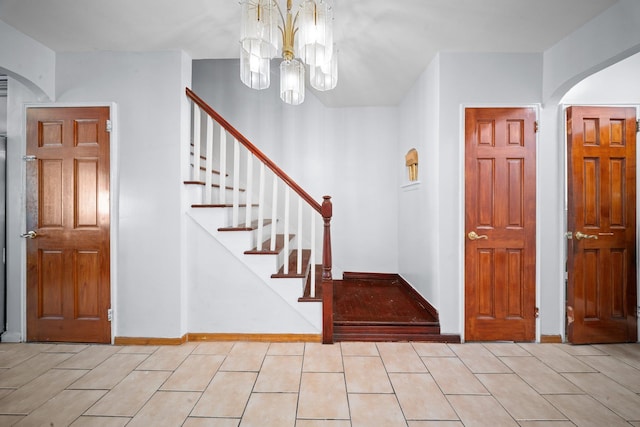 1549 E 57th St, Brooklyn, NY 11234 - entrance foyer with a chandelier, arched walkways, and stairs