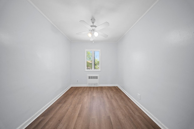1549 E 57th St, Brooklyn, NY 11234 - unfurnished room with radiator heating unit, dark wood finished floors, ornamental molding, baseboards, and a ceiling fan