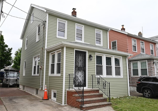 200-13 116th Ave, Saint Albans, NY 11412 - view of front of house with a chimney