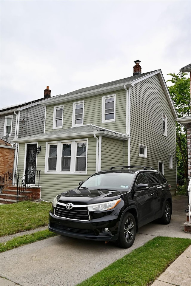 200-13 116th Ave, Saint Albans, NY 11412 - view of side of home featuring a chimney