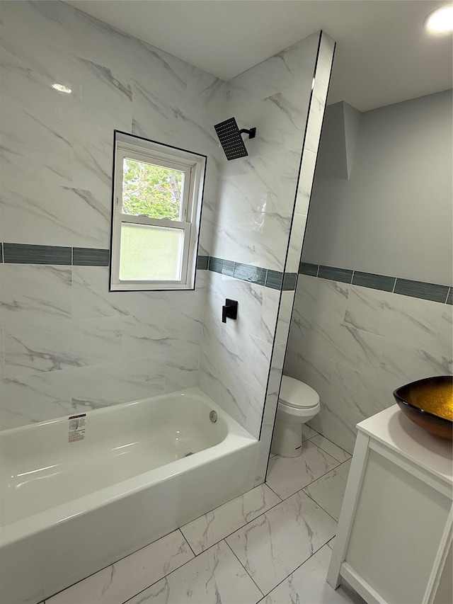 200-13 116th Ave, Saint Albans, NY 11412 - bathroom featuring toilet, vanity, shower / washtub combination, tile walls, and marble look tiles