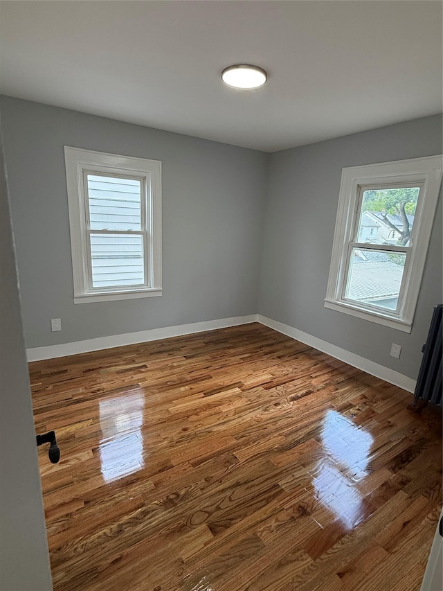 200-13 116th Ave, Saint Albans, NY 11412 - spare room featuring wood finished floors and baseboards