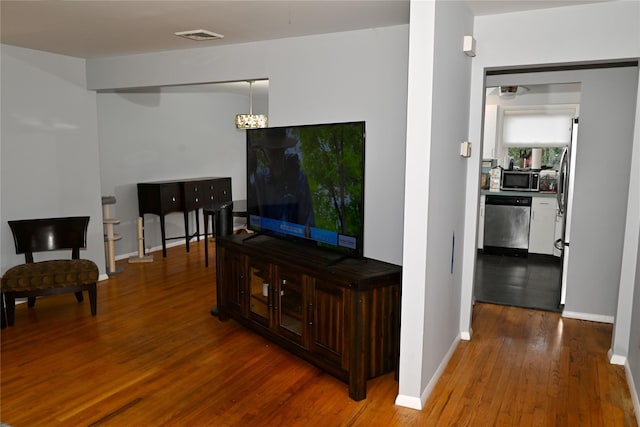 1510 Rica Pl, Valley Stream, NY 11580 - living room with wood finished floors and baseboards