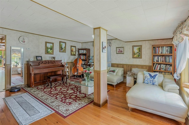20 Baylis Pl, Syosset, NY 11791 - living area with wood-type flooring, wood walls, wainscoting, and ornamental molding