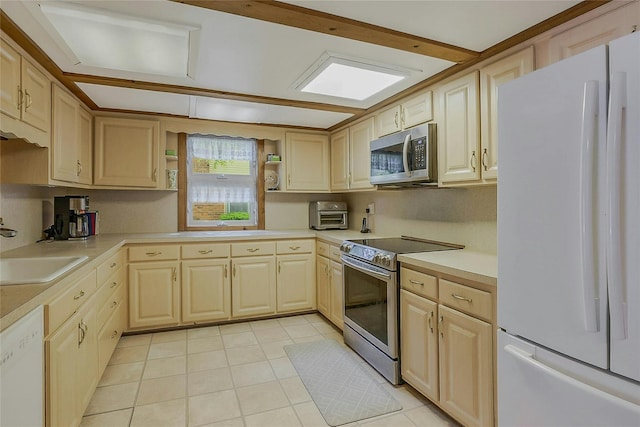 20 Baylis Pl, Syosset, NY 11791 - kitchen with appliances with stainless steel finishes, a sink, light tile patterned floors, light countertops, and light brown cabinets