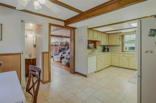 20 Baylis Pl, Syosset, NY 11791 - kitchen featuring white appliances, cream cabinets, a sink, light countertops, and a ceiling fan