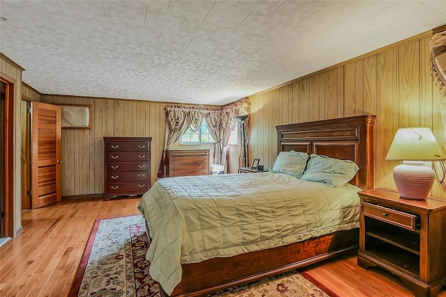20 Baylis Pl, Syosset, NY 11791 - bedroom with wooden walls and hardwood / wood-style floors