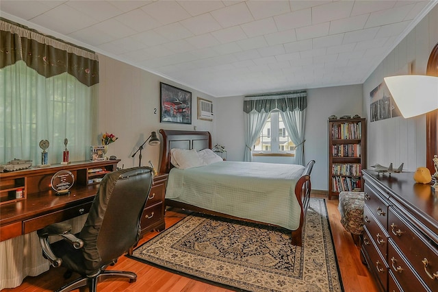 20 Baylis Pl, Syosset, NY 11791 - bedroom featuring ornamental molding, wood finished floors, a wall mounted AC, and an office area