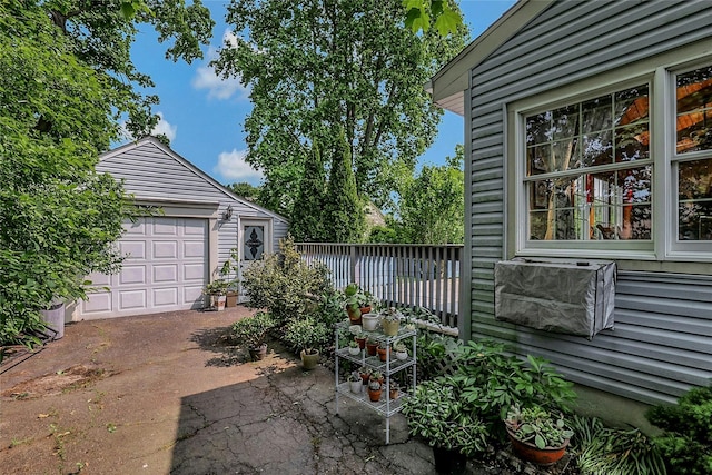 20 Baylis Pl, Syosset, NY 11791 - view of patio / terrace with an outbuilding and a garage