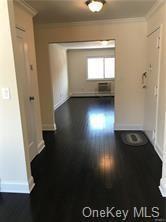 49 Tanager Rd Unit 4905, Monroe, NY 10950 - hallway with baseboards, dark wood-style flooring, and crown molding