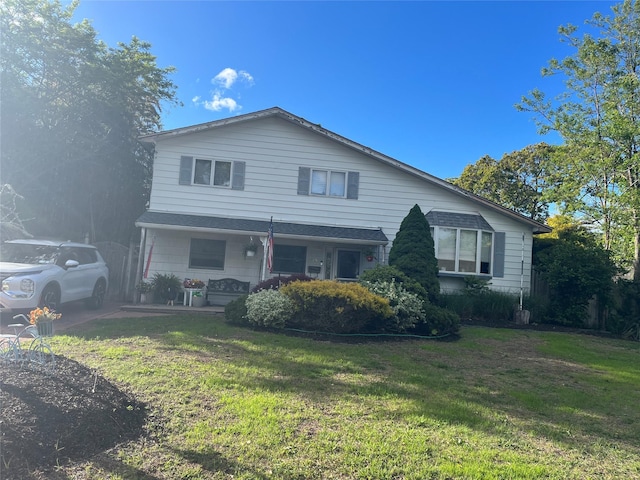 19 Kuebler St, Blue Point, NY 11715 - view of front of property with a front yard and a porch