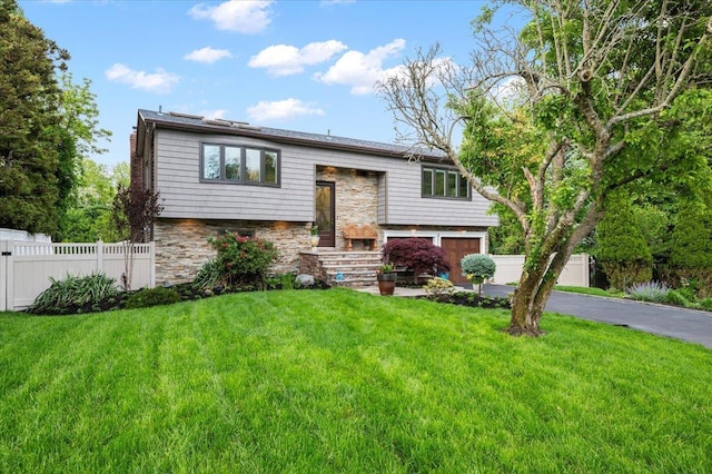 3 Knight Ln, Kings Park, NY 11754 - raised ranch featuring driveway, a garage, and stone siding