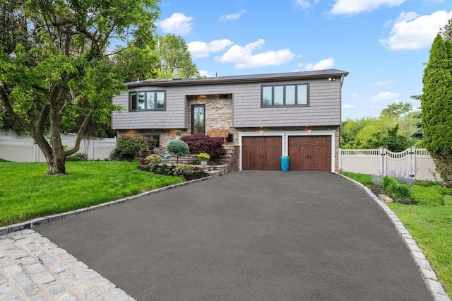 3 Knight Ln, Kings Park, NY 11754 - raised ranch featuring an attached garage, driveway, and stone siding