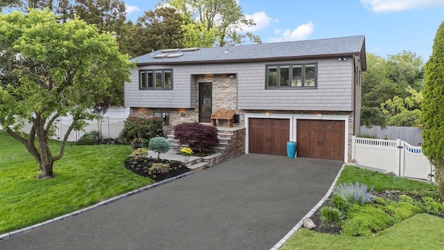 3 Knight Ln, Kings Park, NY 11754 - raised ranch with asphalt driveway, stone siding, and a garage