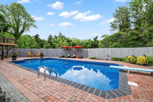 3 Knight Ln, Kings Park, NY 11754 - view of swimming pool with a diving board, a fenced backyard, and a patio area