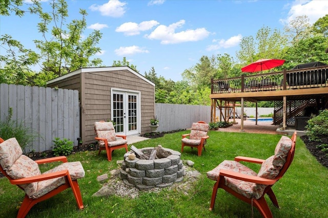 3 Knight Ln, Kings Park, NY 11754 - view of yard with a deck, a fire pit, french doors, and an outdoor structure