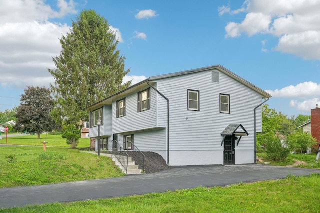 83 Scott Dr, Wappingers Falls, NY 12590 - view of property exterior with a lawn