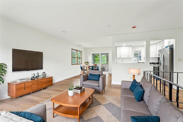 83 Scott Dr, Wappingers Falls, NY 12590 - living room featuring light wood-type flooring and baseboards